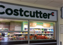 Costcutter signage outside the shop, looking through the shop window